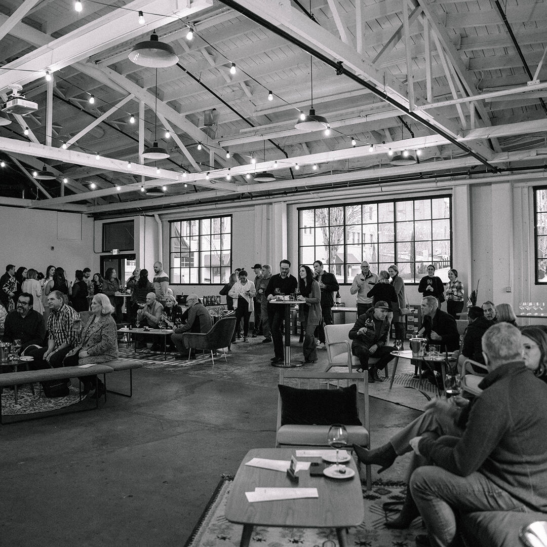 Large group watching bang play in event space